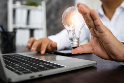 person holding lightbulb as idea