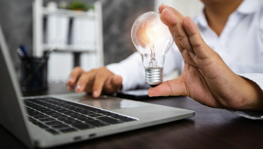 person holding lightbulb as idea