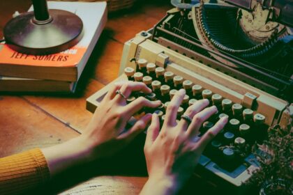 person using typewriter