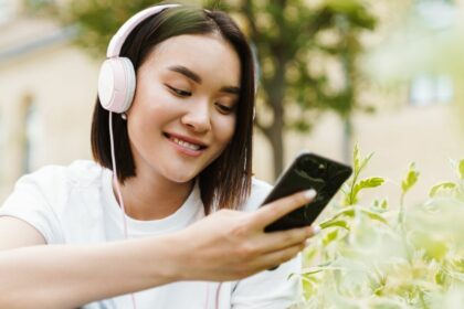 asian woman listening music