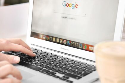 woman using laptop with Google on screen