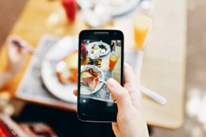 woman using her camera of phone