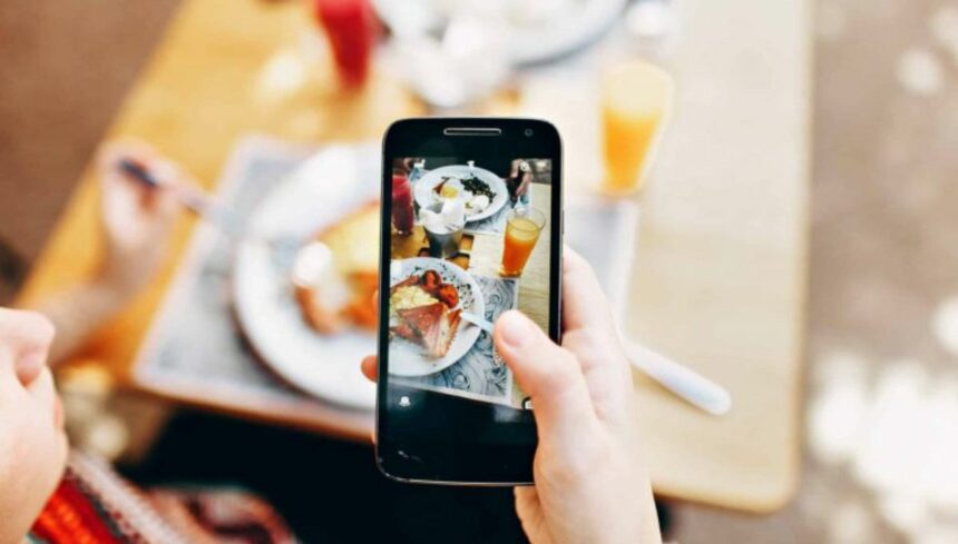 woman using her camera of phone