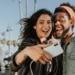 couple taking selfie with mobile camera