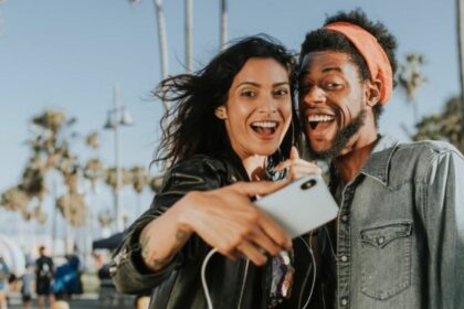 couple taking selfie with mobile camera