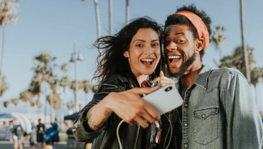 couple taking selfie with mobile camera