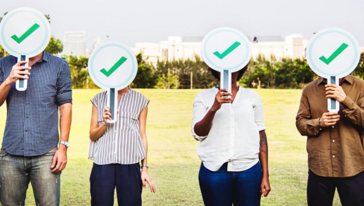 people standing with sign board