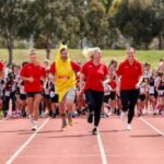 Matt Denny, Nina Kennedy, Sally Pearson, Kelsey-Lee Barber and Brandon Starc racing against little athletes